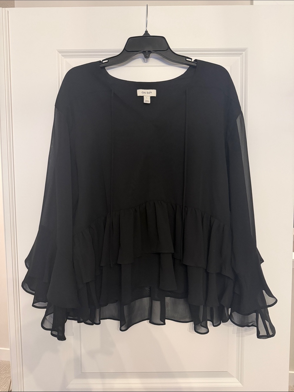 On 34th black ruffled blouse